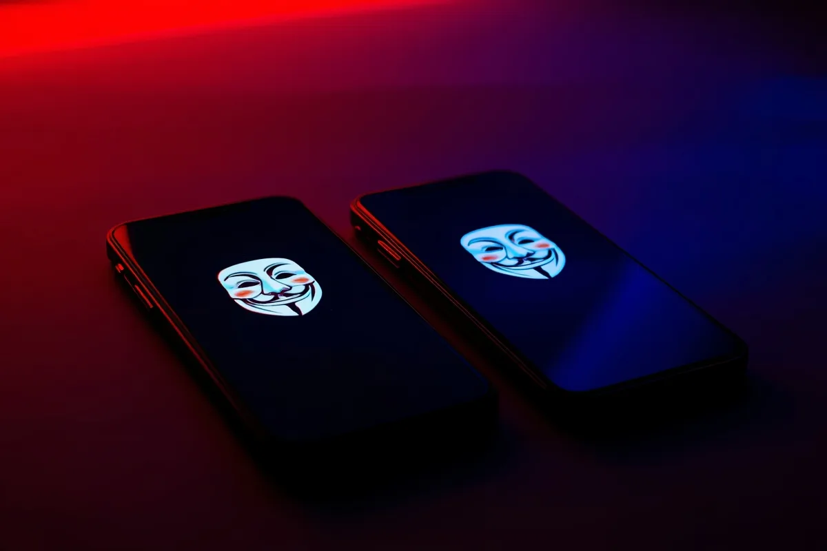 Two phones on a table with anonymous chat interfaces, suggesting mystery